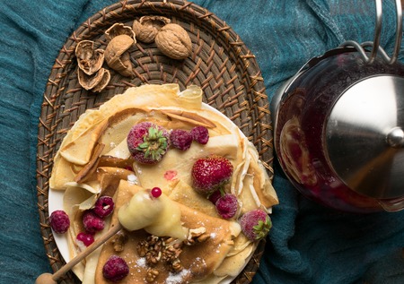 pancakes with berries, walnuts, honeyの写真素材