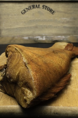 Delicious smoked fish, ocean perch, on wooden background for healthy food, diet or cooking concept,...