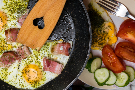 Traditional breakfast with bacon and fried eggsの写真素材
