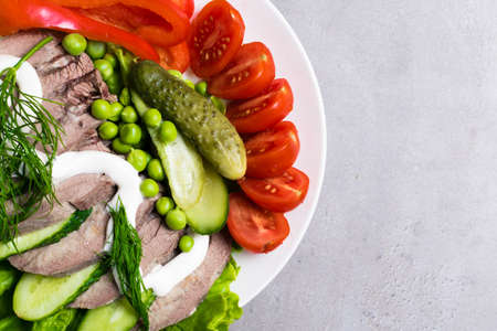 boiled tongue with vegetables tomatoes cucumber lettuce peas with mayonnaise