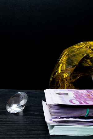 Big pile of euro bank notes isolated with yellow amber gemの写真素材