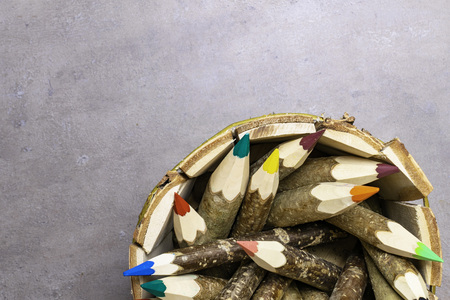 Colorful pencils in wooden holder isolated, back to school, the first september