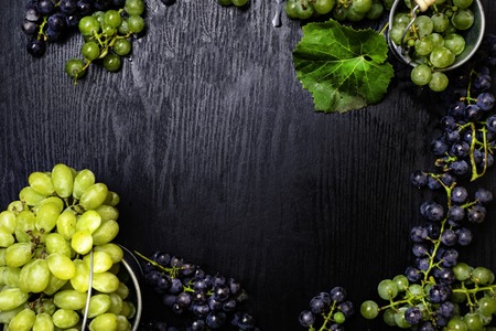 Mix of Fresh grapes on the boards, tasty food, rich of resveratrolの写真素材