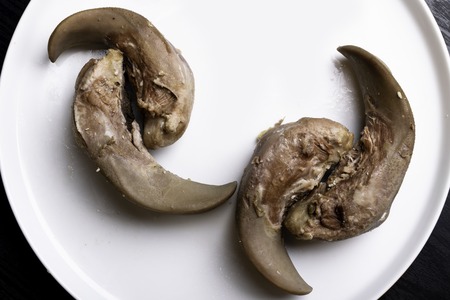 raw pork and beef tongues in white plate, gourment food conception