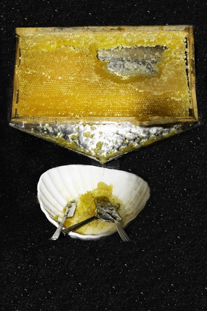 Drops of honey flowing down.