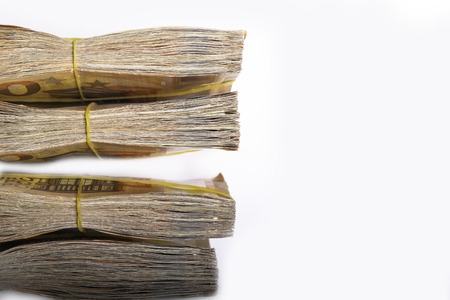 Pile of 50 real euro notes 50-euro banknotes under rubber band, isolated on white background. About 2500 euros worthの写真素材