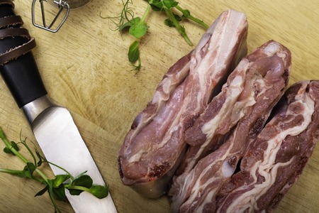 Lamb - mutton - with greenery on wooden board. Top view.の写真素材