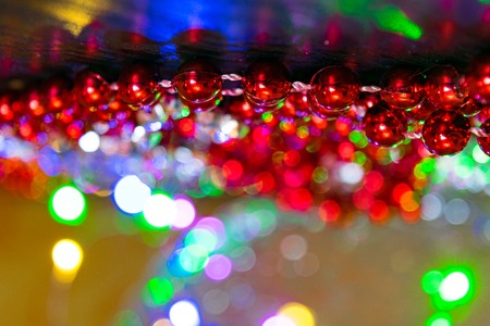 Red glitter vintage lights background. defocused christmas and new year cardの写真素材