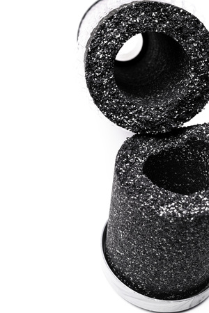 Activated carbon filter isolated on whiteの写真素材