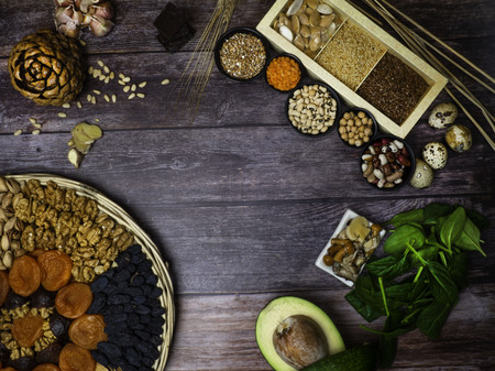 Foods High in Zinc as spinach, mushrooms, pumpkin seeds, garlic, bean, cedar nuts, avocado, eggs, raisins, walnut, ginger, pistachios, apricot, Top viewの写真素材