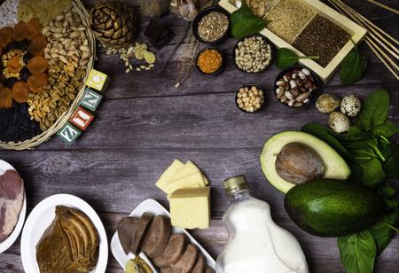 text Zinc, Ingredients or products containing zinc and dietary fiber on wooden board, natural sources of minerals, healthy lifestyle and nutrition, top viewの写真素材