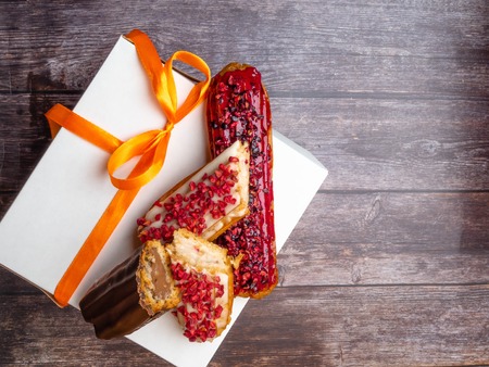 delicious cake with cream, raspberry, blueberry and chocolate, ECLAIRSの写真素材