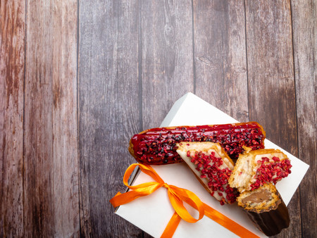 delicious cake with cream, raspberry, blueberry and chocolate, ECLAIRS