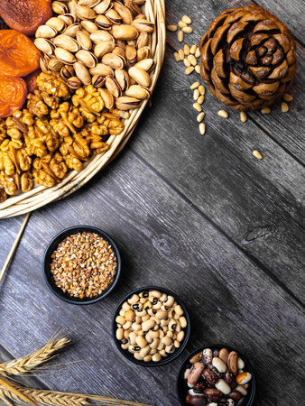 Mixed Nuts, seeds, beans on wooden background Healthy food and snack. foods that boost your brain, food for heartの写真素材