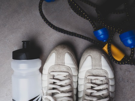 Sports equipment on grey background. Top view. Motivation, healthy lifestyleの写真素材