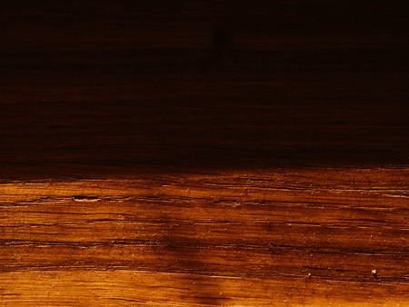 Empty textured vintage wooden surface table background texture with sunlight and shadows on surface,...