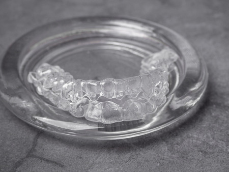 teeth aligners. Invisible brackets in glass Shine smile concept