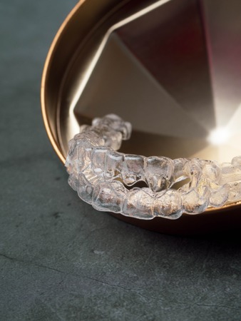 teeth braces or invisible retainer, orthodontic equipment with copy spaceの写真素材