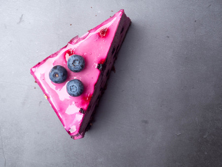 Blueberry cheesecake on concrete with blueberries, with copy spaceの写真素材