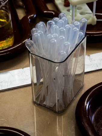 pipette tips, plastic pipettes in a box in laboratory