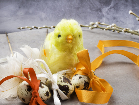 easter eggs, yellow chicken toy, willow- the symbol of Easter, copy space
