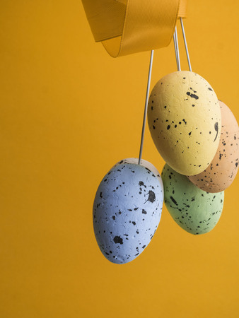 bouqued from color easter eggs on yellow background, copy spaceの写真素材