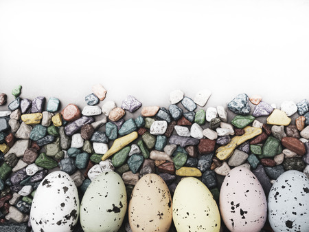 Easter composition with colored eggs, sweets on concreten background, space for text, springtime...