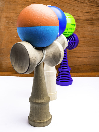 Classic Japanese game kendama on wooden background. Wooden playing kendamas, competition conceptの写真素材