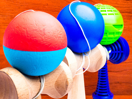 Classic Japanese game kendama on wooden background. Wooden playing kendamas, competition conceptの写真素材