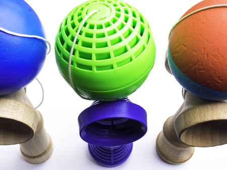 Traditional Japanese toy Kendama on white background, close up Japan wood toy, colorful toy