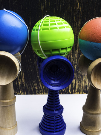 Classic Japanese game kendama on vintage background. colorful playing kendamas, competition conceptの写真素材