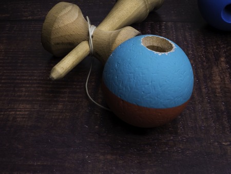 Traditional Japanese toy Kendama on dark background, close up Japan wood toyの写真素材