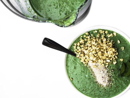 Healthy smoothy for breakfast, Green smoothie in blender isolated onwhiteの写真素材