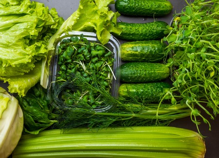 Flat lay series of assorted green toned vegetables, fresh organic raw produce