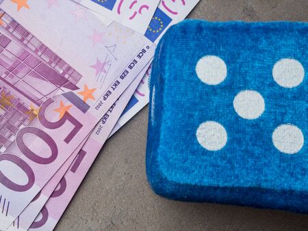 cube chips euro banknotes, Photo in motion. Concept - hope for good luck on concrete table