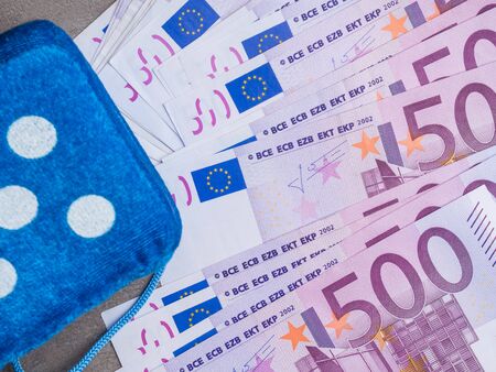 A bill of 500 euros and game cube. Concept - bet on fate, close upの写真素材
