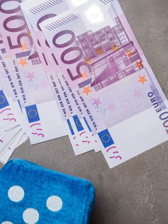 A bill of 500 euros and game cube. Concept - bet on fate, close upの写真素材