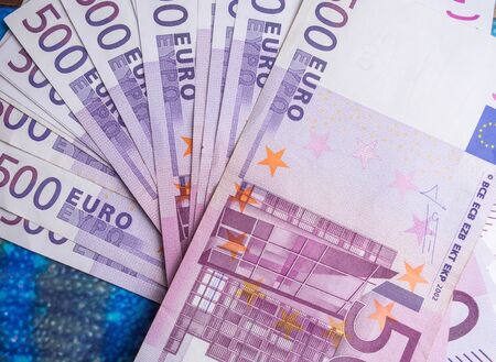 500 euro banknote isolated on blue background, finance concept. cash
