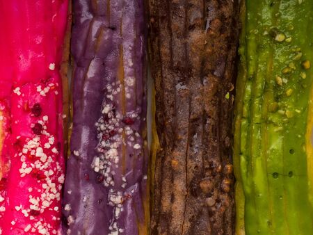 Colorful eclairs close up