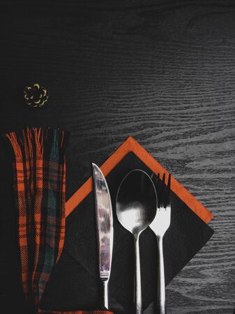 Beautiful Christmas table setting with red ribbon in the cell, coneの写真素材