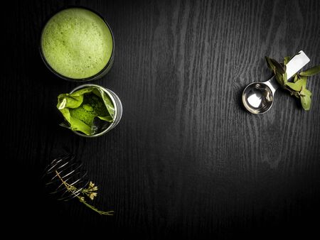 Matcha green tea latte in a cup. Top view. Copy space. Detox coffee
