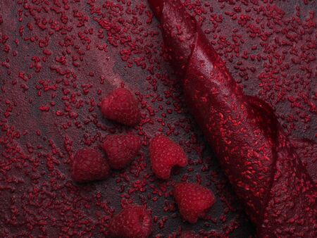 Fruit pastille background. Berry roll-ups made from raspberry, currant. Vitamin rich candy