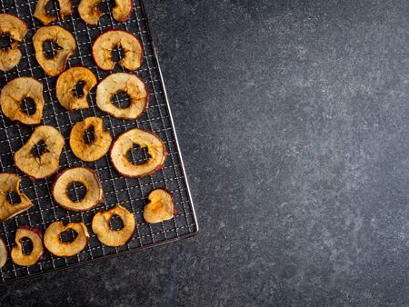 Dried slices of red and yellow apples, rich in ironの写真素材