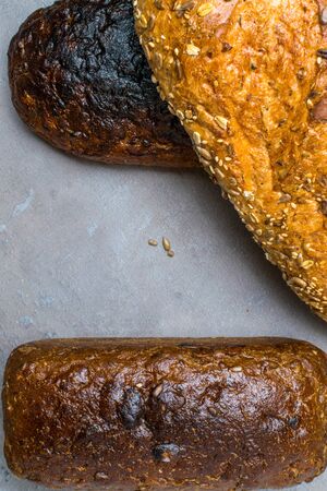 Different fresh bread, on concrete table