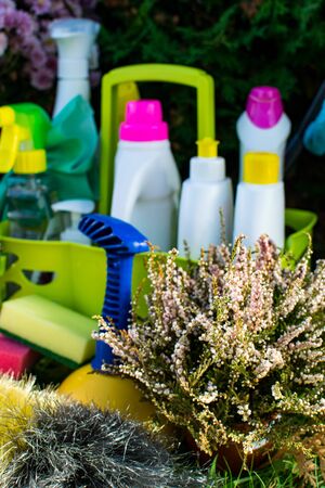 Image with various tools for cleaning the premises and cleaning agents on a blurred natural background. The concept of cleaning the premises, cleanliness, blurredの写真素材