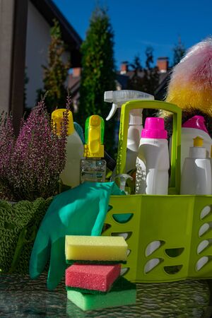 Bottles with detergent and cleaning tools outdoor, clean house conceptの写真素材