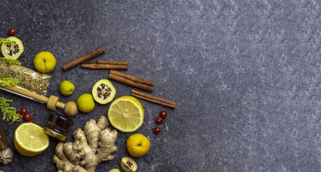 Natural flu and cold remedy ingredients with chamomile, cinnamon sticks, ginger, lemon, honey,...