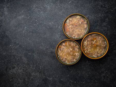 aspic meat jelle in bowls over concrete background, food good for jointsの写真素材