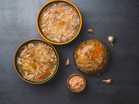Homemade jelly meat with mustard, carrot, and garlic on the table. Holodets, traditional Russian...