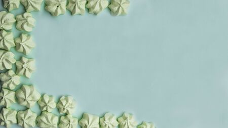 banner of mint merengues on mint pastel color background, copy spaceの写真素材